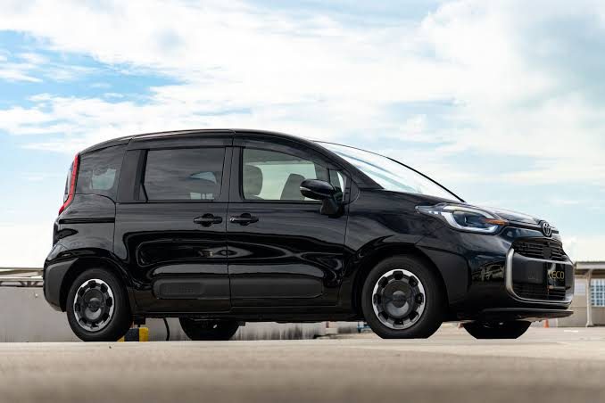Black MPV parked on a rooftop