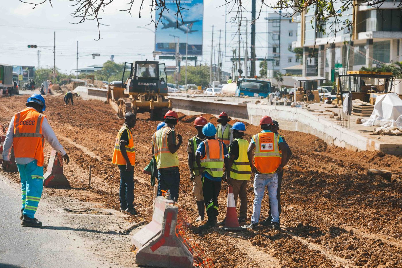 Construction team briefing on a road civil works site