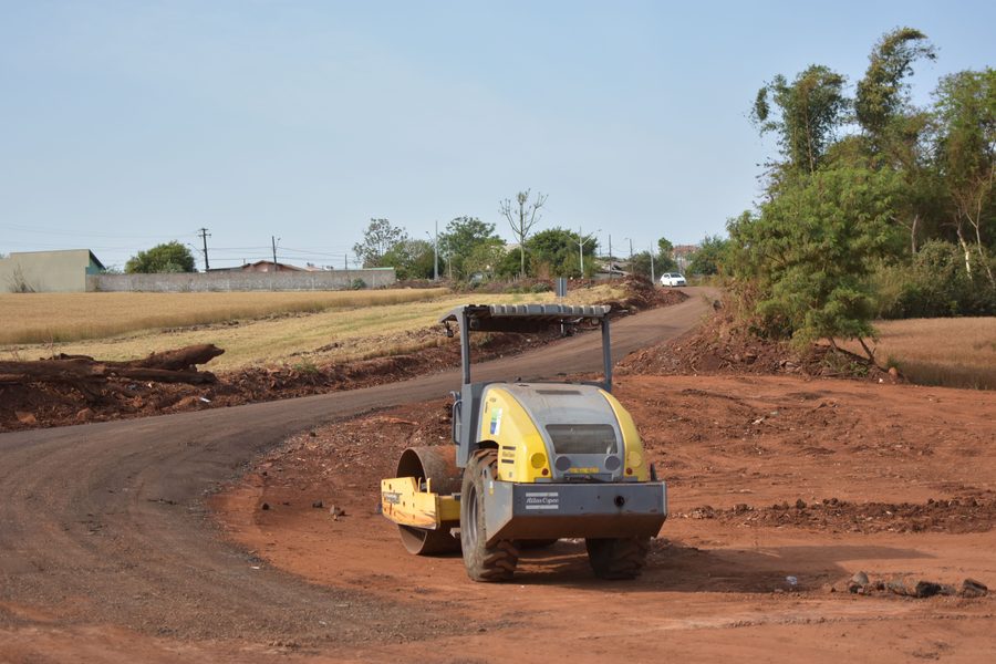 Road roller compacting a dirt road